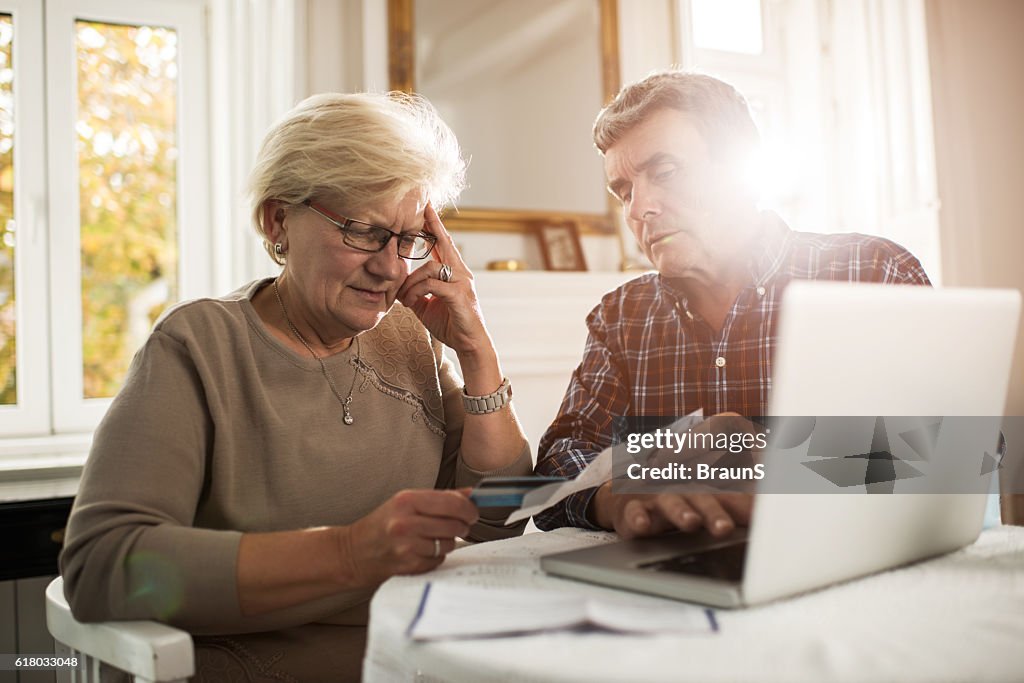 Old couple having problems with their home finances.