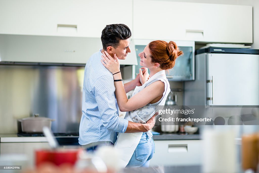 Relaxing Flirting On The Kitchen High-Res Stock Photo - Getty Images