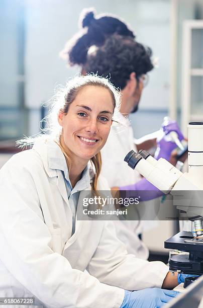 portrait of a scientist in a laboratory - precision oncology stock pictures, royalty-free photos & images