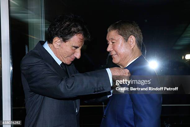 Artist Takeshi Kitano receives the French Legion of Honor By Jack Lang at Fondation Cartier on October 25, 2016 in Paris, France.