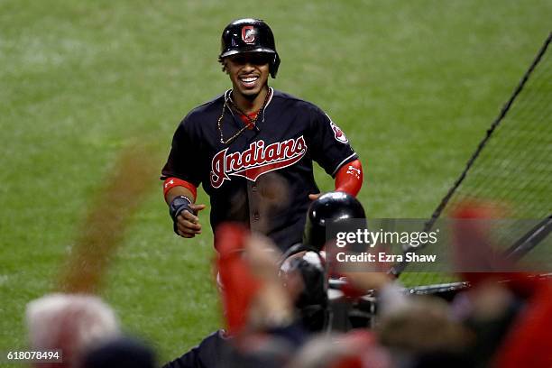 Francisco Lindor of the Cleveland Indians celebrates after scoring a run off of single hit by Jose Ramirez during the first inning against the...