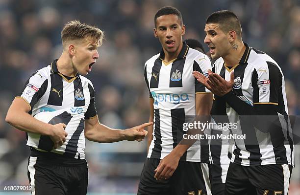 Aleksandar Mitrovic of Newcastle United and Matt Ritchie of Newcastle United argue who will take a penalty during the EFL Cup Fourth Round match...