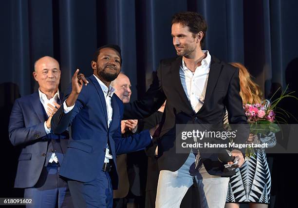 Eric Kabongo and Simon Verhoeven during the 'Willkommen bei den Hartmanns' premiere at Mathaeser Filmpalast on October 25, 2016 in Munich, Germany.