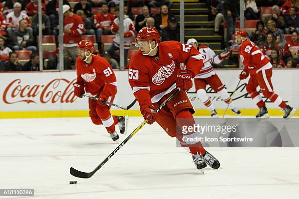 Detroit Red Wings defenseman Alexei Marchenko, of Russia, skates with the puck during the second period of a regular season NHL hockey game between...