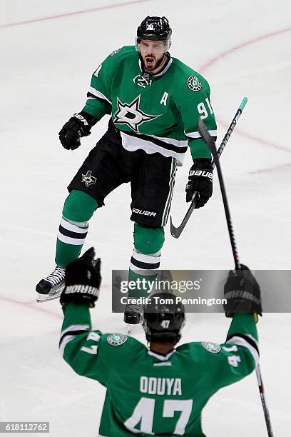 Tyler Seguin of the Dallas Stars celebrates with Johnny Oduya of the Dallas Stars after scoring against the Winnipeg Jets in the third period at...