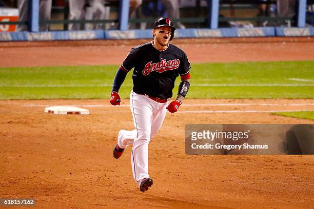 Roberto Perez of the Cleveland Indians reacts as he runs the bases after hitting a three-run home run during the eighth inning against the Chicago...