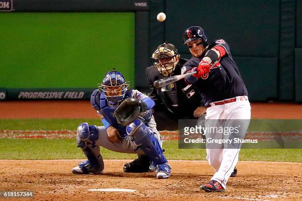 Roberto Perez of the Cleveland Indians hits a three-run home run during the eighth inning against the Chicago Cubs in Game One of the 2016 World...