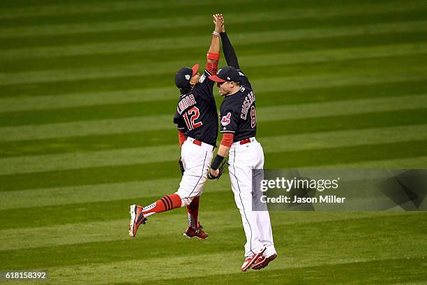 Francisco Lindor of the Cleveland Indians celebrates with Lonnie Chisenhall after defeating the Chicago Cubs 6-0 in Game One of the 2016 World Series...
