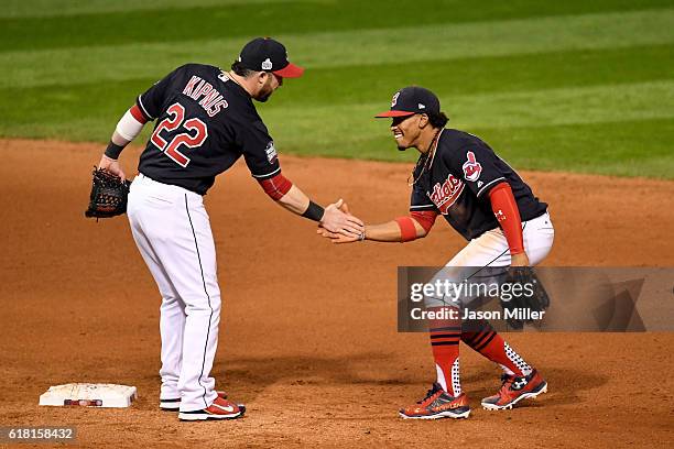 Jason Kipnis of the Cleveland Indians celebrates with Francisco Lindor after defeating the Chicago Cubs 6-0 in Game One of the 2016 World Series at...