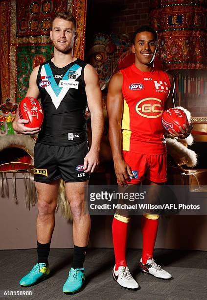 Robbie Gray of the Power and Touk Miller of the Suns pose for a photograph during an AFL announcement at The Chinese Museum Melbourne on October 26,...