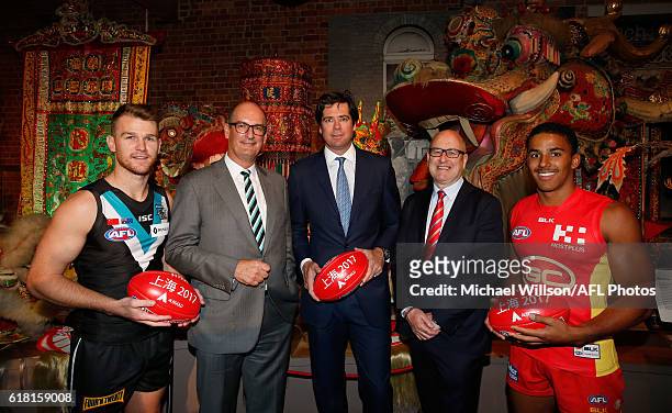 Robbie Gray of the Power, Power President David Koch, AFL CEO Gillon McLachlan, Suns Chairman Tony Cochrane and Touk Miller of the Suns pose for a...