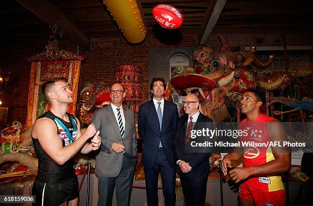 Robbie Gray of the Power, Power President David Koch, AFL CEO Gillon McLachlan, Suns Chairman Tony Cochrane and Touk Miller of the Suns pose for a...