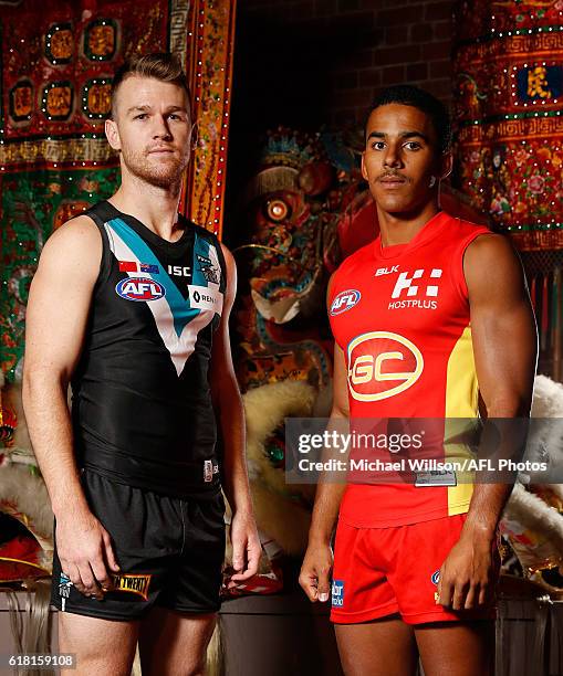 Robbie Gray of the Power and Touk Miller of the Suns pose for a photograph during an AFL announcement at The Chinese Museum Melbourne on October 26,...