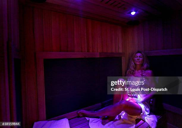 Kasia Radecka of St. Louis relaxes in an infrared sauna on Friday, Oct. 7 at Sol Sweat in Kirkwood, Mo. "I grew up in Poland and doctors used to...