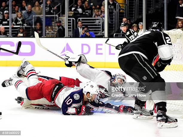 Alec Martinez of the Los Angeles Kings scores the game winning goal past a diving Sergei Bobrovsky and Alexander Wennberg of the Columbus Blue...