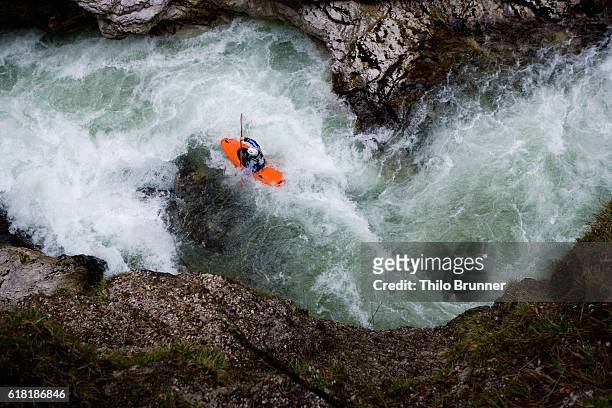kayaker going down river - kajak stock-fotos und bilder