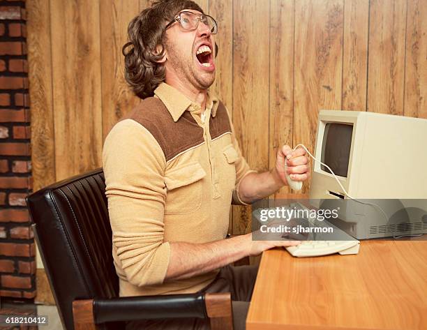 funny angry 1980's office worker - delete key stockfoto's en -beelden