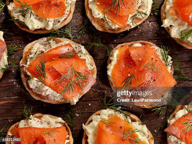smoked salmon canapes with avocado cream cheese - canape stock pictures, royalty-free photos & images