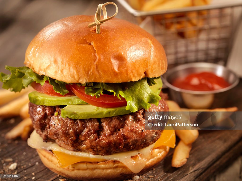 Avocado Cheeseburger with a Basket of Fries