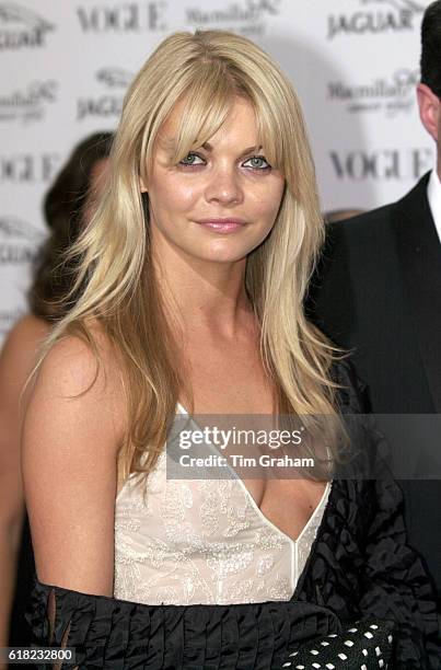 Headshot portrait Model Jemma Kidd wearing a low cut dress by Giorgio Armani at Celebrity Fashion Show. Cleavage Blonde hair Fringe