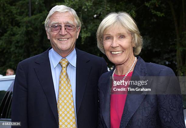 Presenter Michael Parkinson and wife Mary at society party in London. Couple Happy Smiling
