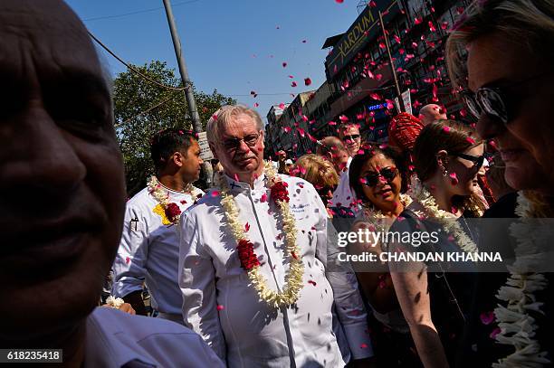 Chef to the President of the Republic of Finland, Isto Tahvanainen, walks with other chefs to various heads of states as they visit the spice market...