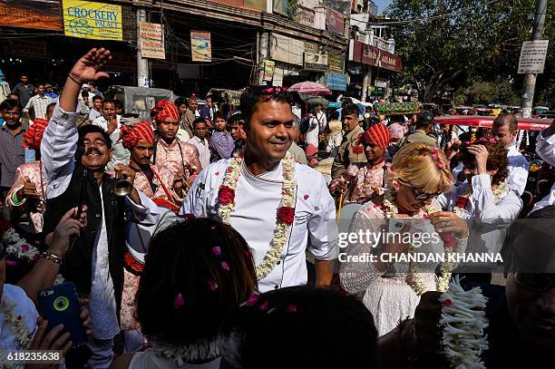 Chef of the President of the Republic of India, Montu Saini, looks on as he walks with other chefs to various heads of state as they visit the spice...