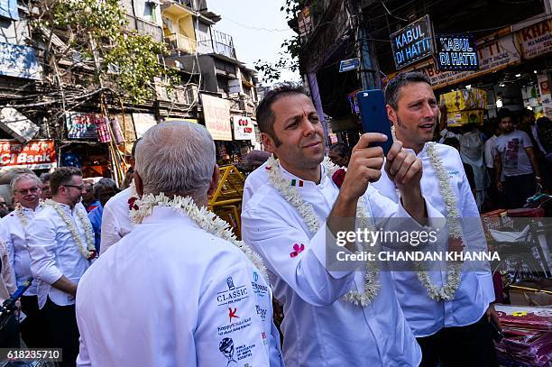Chef to the President of Italy, Fabrizio Boca , walks with his Sous Chef as he takes photograph during a visit by the chefs to various heads of state...
