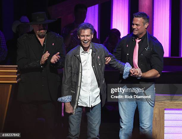 Eddie Montgomery and Troy Gentry escort Singer/Songwriter Randy Travis on stage at Jason Aldean's 11th Annual Event Benefitting Susan G. Komen As...