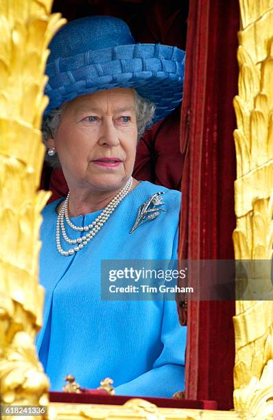 British Monarchy Queen Elizabeth II as Head of State in the Gold State Coach carriage on Golden Jubilee Day. She used it previously for her...