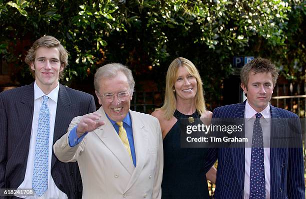 Broadcaster Sir David Frost, with his wife Carina and sons Miles and Wilfred, at his annual party in Chelsea.