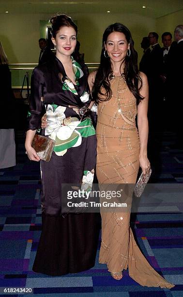 Actors Lucy Liu and Drew Barrymore at Movie Premiere Charlies' Angels in London. Actresses Evening Dresses