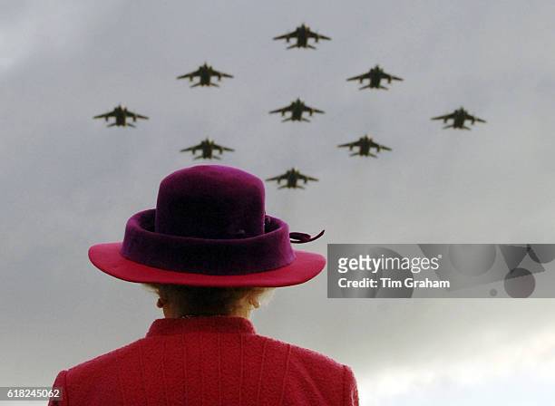 Queen Elizabeth II on a visit to RAF Coltishall watches RAF Jaguar planes in a diamond 9 formation.