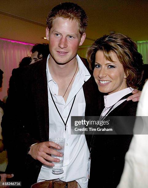 Prince Harry meets news presenter Natasha Kaplinsky at the after-concert party the Princes hosted to thank all who took part in the "Concert for...