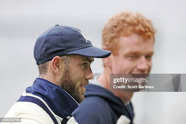 12th man Glenn Maxwell of Victoria and Andrew McDonald, Head Coach of Victoria look on during day two of the Sheffield Shield match between Victoria...