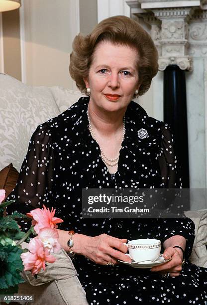 British Prime Minister Margaret Thatcher drinking tea at home in her official residence 10 Downing Street, London