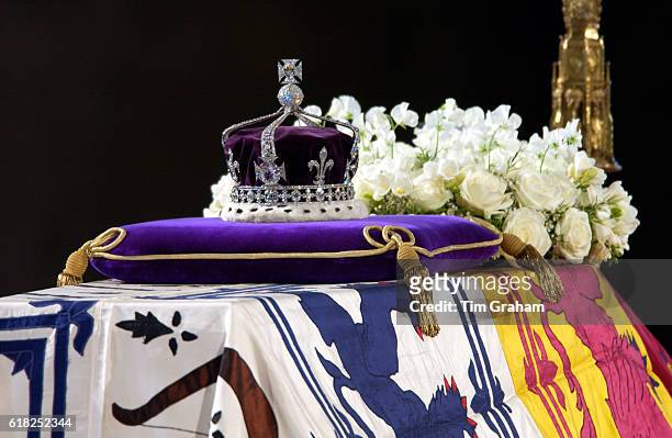 Close-up of the Queen Mother's coffin, the wreath of white flowers and the Queen Mother's coronation crown with the priceless Koh-I-Noor diamond.