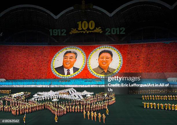 Kim il sung and kim jong il portraits during the arirang mass games at may day stadium, pyongyang, North Korea on September 6, 2012 in Pyongyang,...
