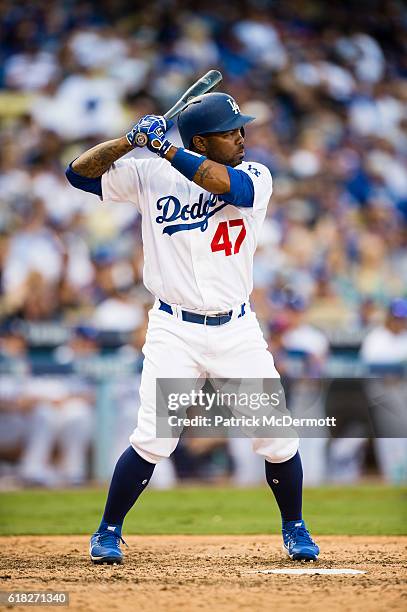 Howie Kendrick of the Los Angeles Dodgers bats against the Washington Nationals during the seventh inning in game three of the National League...