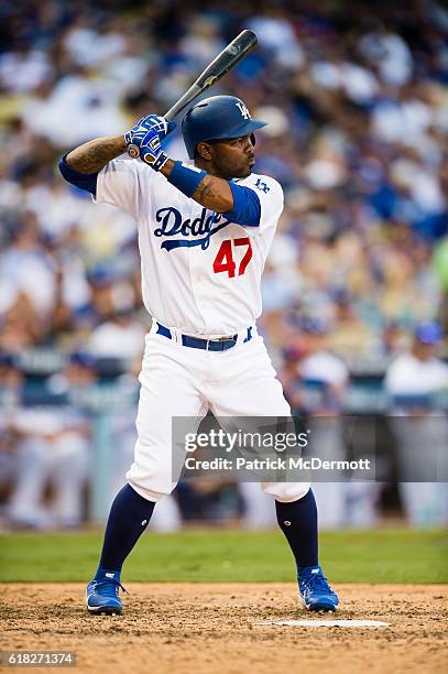 Howie Kendrick of the Los Angeles Dodgers bats against the Washington Nationals during the seventh inning in game three of the National League...