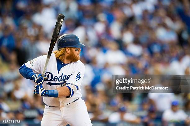 Justin Turner of the Los Angeles Dodgers bats against the Washington Nationals during the seventh inning in game three of the National League...