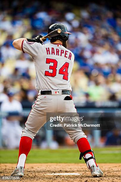 Bryce Harper of the Washington Nationals bats against the Los Angeles Dodgers during the ninth inning in game three of the National League Division...