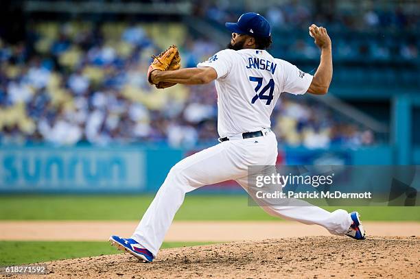 Kenley Jansen of the Los Angeles Dodgers throws a pitch to a Washington Nationals batter during the ninth inning in game three of the National League...