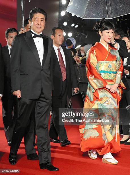 Japanese Prime Minister Shinzo Abe and actress Haru Kuroki walk on the red carpet during the Tokyo International Film Festival 2016 Opening Ceremony...