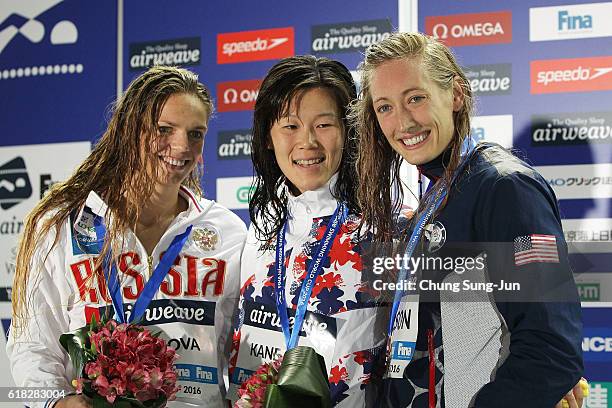 Yuiya Efimova of Russia, Rie Kanetou of Japan and Breeja Larson of United States pose on the podium after the Women's 200m Breaststroke final during...