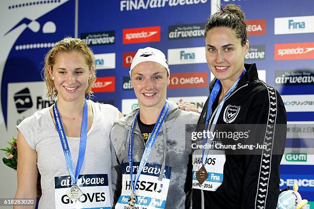 Madeline Groves of Australia, Katinka Hosszu of Hungary and Zsuzsanna Jakabos of Hungary pose on the podium after the Women's 200m Butterfly final...