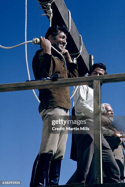 Entertainer Dean Martin shoots a scene on the set of the 20th Century Fox film 'Bandolero!' in 1967.