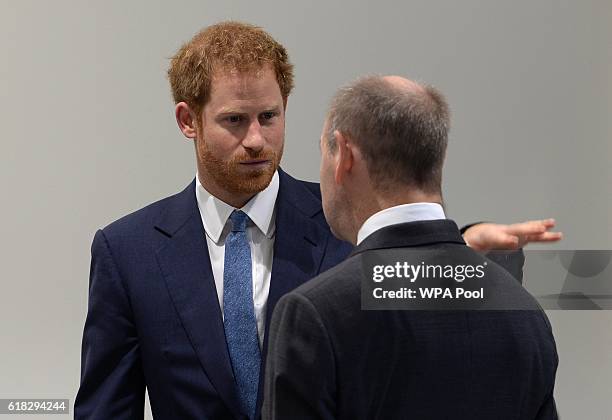 Prince Harry talks to Lord-Lieutenant of Nottinghamshire Sir John Peace at the opening of Nottingham's new Central Police Station on October 26, 2016...