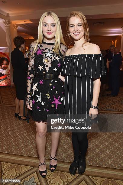 Actress and Save the Children Artist Ambassador Dakota Fanning and singer/songwriter and Save the Children Artist Ambassador Bridgit Mendle attend...