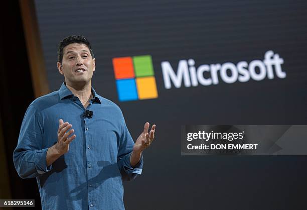 Microsoft executive Terry Myerson speaks at a Microsoft news conference to unveil updated versions of its the Surface Book and the Surface Pro 4...